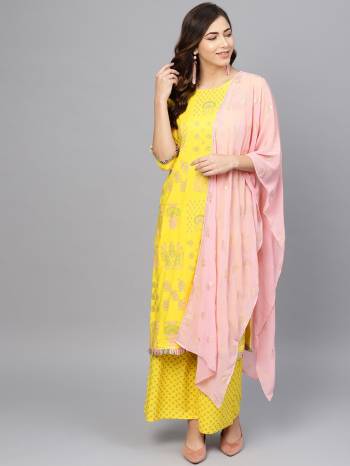 Look Pretty In This Beautiful Readymade Designer Suit In Yellow Color Paired With Baby Pink Colored Dupatta. Its Top And Bottom Are Rayon Based Beautified With Prints Paired With Georgette Fabricated Foil Printed Dupatta. 