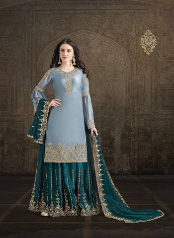 Be The Trend Setter Wearing This Heavy Designer Suit In Powder Blue Colored Top Paired With Teal Blue Colored Bottom And Dupatta. Its Embroidered Top And Bottom Are Satin Based Paired With Heavy Embroidered Georgette Fabricated Dupatta. Buy Now.