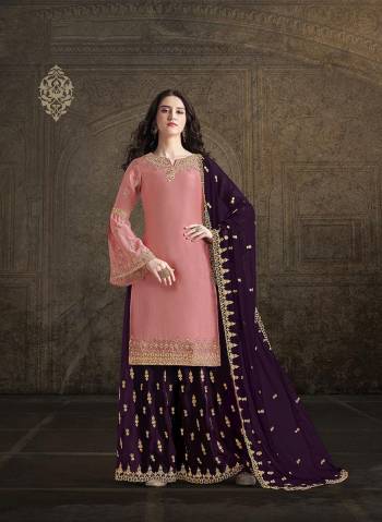 Get Ready For This Wedding And Festive Season With This Heavy Designer Suit In Pink Colored Top Paired With Purple Colored Bottom And Dupatta. Its Top And Bottom Are Fabricated On Satin Paired With georgette Fabricated Dupatta. Its Pretty Top, Bottom And Dupatta Are Beautified With Detailed Heavy Embroidery. 