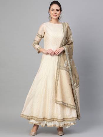 Celebrate This Festive Season With Beauty And Comfort Wearing This Designer A-Line Suit In Cream Color. Its Top Is Fabricated On Chanderi Paired With Art Silk Fabricated Dupatta. Buy This Rich And Elegant Looking Suit Now.