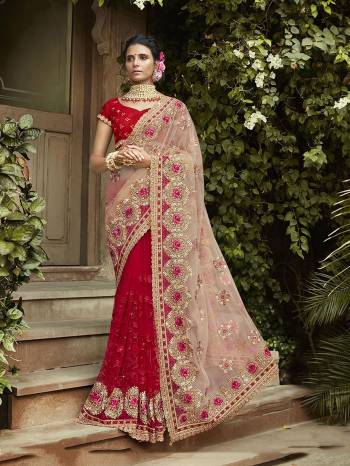 You Will Definitely Earn Lots Of Compliments Wearing This Heavy Designer Saree In Baby Pink And Red Color Paired With Red Colored Blouse. This Heavy Embroidered Saree Is Fabricated On Net Paired With Georgette Fabricated Embroidered Blouse. 