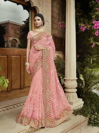 Look Pretty Wearing This Heavy Designer Saree In Pink Color Paired With Pink Colored Blouse. This Saree Is Net Based Beautified With Heavy Attractive Embroidery Paired With georgette Fabricated Blouse. 