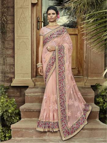 Grab This Attractive Heavy Designer Saree In Pastel Pink Color Paired With Pastel Pink Colored Blouse. This Saree Is Fabricated on Net Paired With Georgette Fabricated Blouse. Its Pretty Color Pallete And Detailed Embroidery Will Definitely Earn You Lots Of Complimets From Onlookers. 