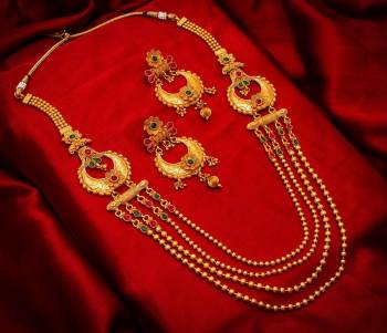 Give An Enhanced Look To Your Personality By Pairing Up This Beautiful Necklace Set With Your Ethnic Attire. This Pretty Set Is In Golden Color Beautified With Stone Work. Buy Now.