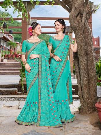 Adorn The Pretty Angelic Look Wearing This Heavy Designer Turquoise Blue Colored Saree Paired With Turquoise Blue Colored Blouse. This Saree Is Fabricated On Georgette Paired With Art Silk Fabricated Blouse. It Embroidery And Color Gives An Attractive Look To Your Personality. 