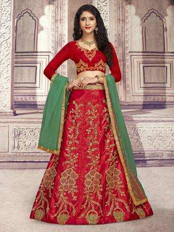 Here Is A Heavy Designer Lehenga Choli In Red Color Paired With Contrasting Green Colored Dupatta. Its Blouse Is Fabricated On Art Silk Paired With Satin Silk Fabricated Lehenga And Net Dupatta. Its Pretty Blouse And Lehenga Are Beautified With Embroidery Which Comes With A Net Dupatta With Lace Border. Buy Now.