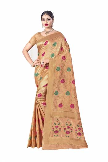 Here Is A Royal Looking Designer Silk Based Saree In Light Orange Color. This Saree Is Fabricated on Banarasi Art Silk Paired With Art Silk Fabricated Blouse. Its Color And Rich Fabric Will Earn You Lots Of Compliments From Onlookers. 