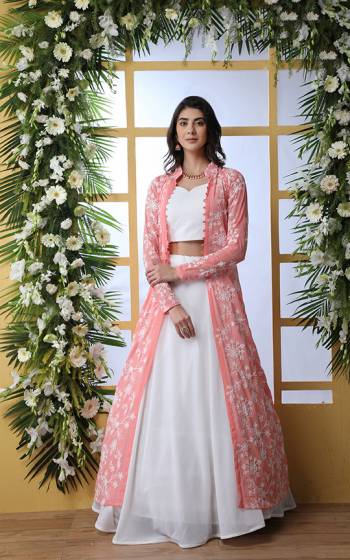 Set A New And Latest Trend In Indo-Western Lehenga Choli With Jacket With This Designer Piece. Its Blouse And Lehenga Are In White Color Paired With Pink Colored Embroidered Jacket. It Blouse, Lehenga And Jacket are Fabricated Georgette Which Is Light Weight And Easy To Carry All Day Long. 