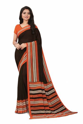 No More Worry For What To Wear At Your Place, Grab This Georgette?Fabricated Saree And Blouse Beautified With Prints All Over. This Saree Can Be Used As Uniform At Different Places Like Airports, Hospitals And Hotels?
