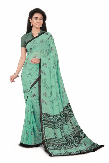 No More Worry For What To Wear At Your Place, Grab This Georgette?Fabricated Saree And Blouse Beautified With Prints All Over. This Saree Can Be Used As Uniform At Different Places Like Airports, Hospitals And Hotels?