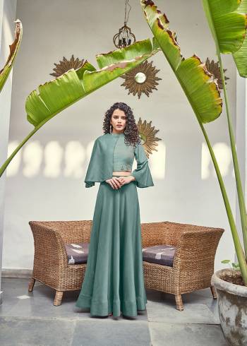 New Shade Is Here To add Into Your Wardrobe With A New And Unique Color Shade In Dusty Green. This Readymade Pair Of Crop Top And Skirt Are Silk Based With A Unqiue Asymetric pattern.  Buy Now.