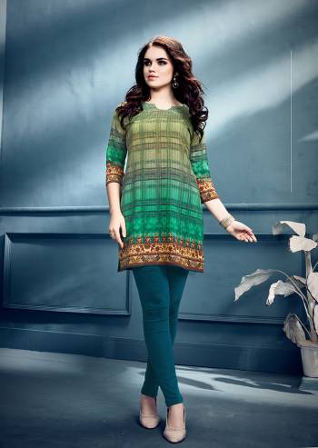 Simple and Elegant Looking Short Kurti Is Here In Green Color. This Readymade Kurti In Crepe Based Beautified With Prints All Over. Buy Now.