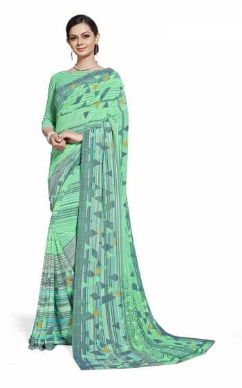 Here Is Very Pretty Printed Saree Fabricated On Georgette Paired With Running Blouse, This Pretty Formal Printed Saree Is Best Suitable For Your Work Place As It Is Light Weight And Esnures Superb Comfort All Day Long. Also It Can Be Used As Uniform At Different Places Like Airports, Hospitals And Hotels. Buy Now