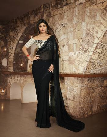 For A  Bold And Beautiful Look, Grab This Designer Saree In Black Color Paired With grey Colored Checks Blouse. This Saree IS Fabricated on Georgette Paired With Cotton Based Blouse, Buy Now.