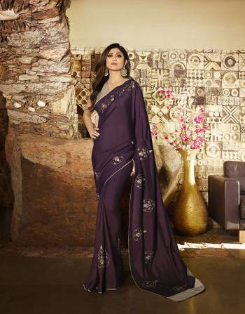 You Will Definitely Earn Lots Of Compliments Wearing This Elegant Looking Designer Saree In Wine Color Paired With Grey Colored Blouse. This Saree And Blouse Are Silk Based Giving A Rich Look To Your Personality. 