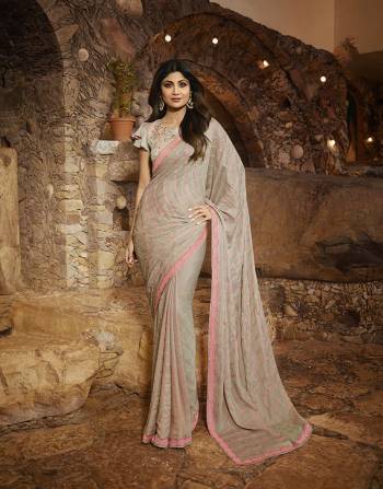 Celebrate This Festive Season With Beauty And Comfort Wearing This Designer Saree In Grey Color Paired With Grey Colored Blouse. This Saree Is Fabricated On Satin Silk Paired With Satin Silk Fabricated Blouse. It Is Beautified With Elegant Resham & Jari Embroidery. 