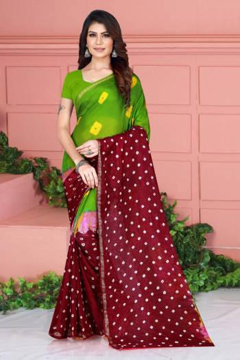 Grab This Pretty Designer Bandhani Saree In Green And Maroon Color. This Saree And Blouse Are Fabricated On Tafeta Art Silk Beautified With Prints. It Is Light In Weight And Easy To Carry All Day Long. 