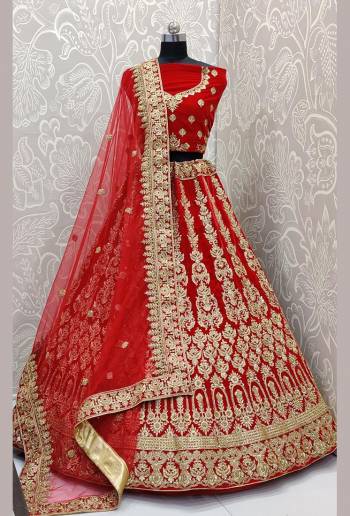 Here Is A Very Beautiful and Heavy Bridal Lehenga Choli In All over Red Color. This Lehenga Choli Is Fabricated on Velvet Paired With Net Fabricated Dupatta. It Is Beautified With Heavy Embroidery Which Will Earn You Lots of Compliments From Onlookers. 