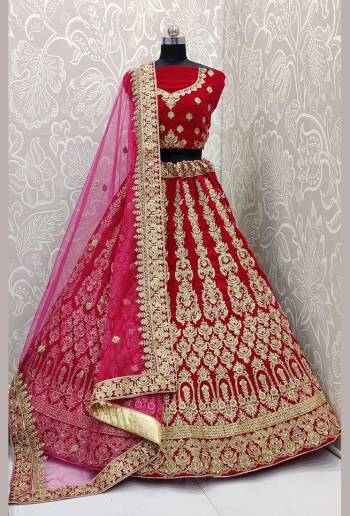 Here Is A Very Beautiful and Heavy Bridal Lehenga Choli In All over Rani Pink Color. This Lehenga Choli Is Fabricated on Velvet Paired With Net Fabricated Dupatta. It Is Beautified With Heavy Embroidery Which Will Earn You Lots of Compliments From Onlookers. 