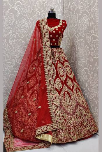 Here Is A Very Beautiful and Heavy Bridal Lehenga Choli In All over Red Color. This Lehenga Choli Is Fabricated on Velvet Paired With Net Fabricated Dupatta. It Is Beautified With Heavy Embroidery Which Will Earn You Lots of Compliments From Onlookers. 