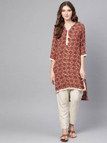 Add This Pinted Readymade Kurti To Your Wardrobe For Casual Wear In Brown Color. This Kurti Is Rayon Fabricated Which IS Soft Towards Skin And Easy To Carry all Day Long. 