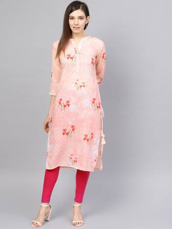 Look Pretty In This Lovely Baby Pink Colored Readymade Kurti. This Pretty Kurti IS Muslin Based Beautified With Prints All Over. 