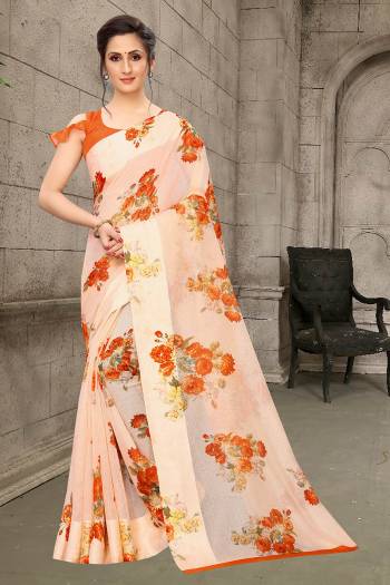 Simple And Elegant Looking Designer Saree In Here In Light Orange Color Paired With Orange Colored Blouse. This Saree And Blouse Are Fabricated On Linen Cotton Beautified With Floral Prints All Over. Its Soft Rich Fabric And Elegant Color Will Give A Rich look To Your Personality. 
