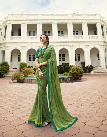 Here Is A Pretty Printed Saree In Green Color Paired With Teal Green Colored Blouse. This Saree Is Fabricated On Georgette Paired With Art Silk Fabricated Blouse. It Is Light Weight And Easy To Carry All Day Long. 