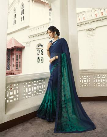 Enhance Your Personality Wearing This Lovely Designer Saree In Navy Blue Color paired With Navy Blue Colored Blouse. This Printed Saree Is Fabricated on Georgette Paired With Art Silk Fabricated Blouse. 