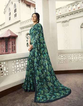 Enhance Your Personality Wearing This Lovely Designer Saree In Teal Blue Color paired With Teal Blue Colored Blouse. This Printed Saree Is Fabricated on Georgette Paired With Art Silk Fabricated Blouse. 