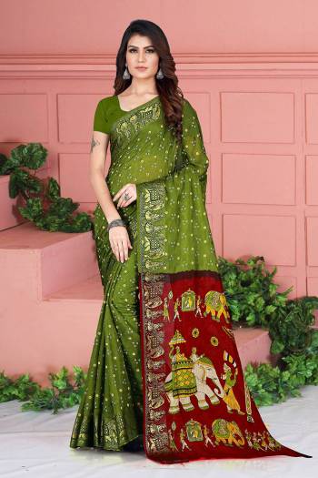 For A Proper Traditional Look, Grab This Designer Silk Based Saree In Olive Green Color. This Saree And Blouse Are Fabricated On Art Silk Beautified With Weave And Prints. Its Fabric Is Durable, Light Weight And Easy To Carry All Day Long. 