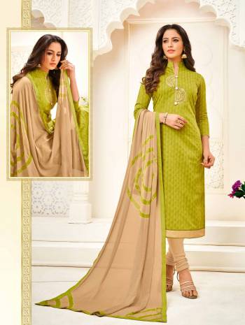 Add This Designer Straight Suit In Green Colored Top Paired With Beige Colored Bottom And Dupatta. Its Top Is Fabricated On Cotton Jacquard Paired With Cotton Bottom And Chiffon Fabricated Dupatta. It Is Beautified With Hand Work. Buy Now.