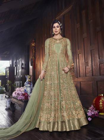 Flaunt Your Rich And Elegant Taste In This Lovely Designer Indo-Western Suit In Pastel Green Color. It Has Elegant Looking Floor Length Gown Fabricated on Art Silk With Embroidered Net Fabricated Jacket Paired With Art Silk Fabricated bottom And Net Dupatta. 