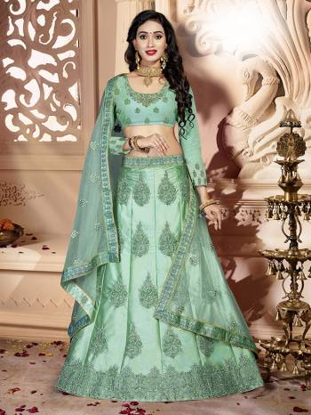 Flaunt Your Rich And Elegant Taste Wearing This Designer Lehenga Choli In All Over Sea Green Color. Its Blouse Is Fabricated On Art Silk Paired With Satin Silk Fabricated Lehenga And Net Fabricated Dupatta. It Is Beautified With Pretty Tone To Tone Embroidery. 