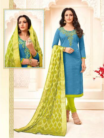 Add This Beautiful Designer Cotton Based Suit To Your Wardrobe In Blue Colored Top Paired With Contrasting Parrot Green Colored Bottom And Dupatta. Its Attractive Part Is Its Jacquard Silk Based Dupatta. Buy Now.