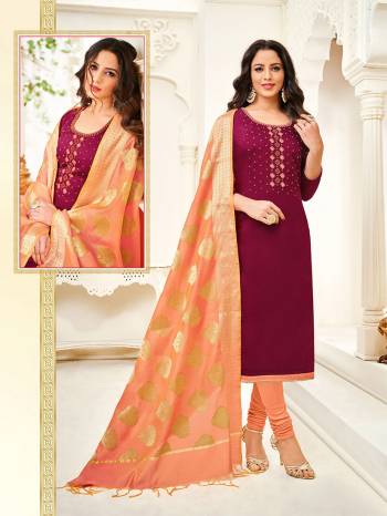 Here Is A Royal Looking Designer Straight Suit In Maroon Colored Top Paired With Contrasting Peach Colored Bottom And Dupatta. Its Top Is Fabricated On Cotton Silk Paired With Cotton Bottom And Jacquard Silk Fabricated Dupatta. It Is Beautified With Hand Work. 