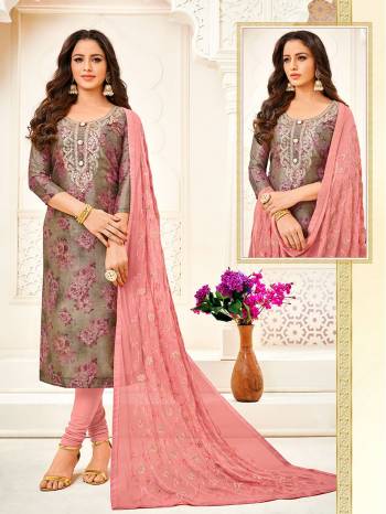 Here Is A Very Pretty Designer Straight Suit In Dark Grey Colored Digital Printed Top Paired With Dusty Pink Colored Bottom And Dupatta. Its Top Is Fabricated On Soft Silk Paired With Cotton Bottom And Chiffon Dupatta. 