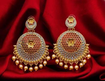 Here Is A Lovely Designer Patterned Earrings Set To Pair Up With Your Heavy Ethnic Wear. This Pretty Pair Is Light In Weight And Easy To Carry Throughout The Gala. 