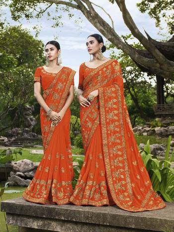 Add This Beautiful Heavy Designer Saree To Your Wardrobe In Orange Color Paired With Orange Colored Blouse. This Saree And Blouse Are Fabricated On Art Silk Beautified With Heavy Embroidery. 