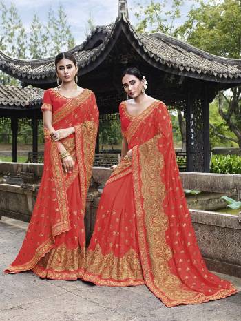 Add This Beautiful Heavy Designer Saree To Your Wardrobe In Orange Color Paired With Orange Colored Blouse. This Saree And Blouse Are Fabricated On Art Silk Beautified With Heavy Embroidery. 