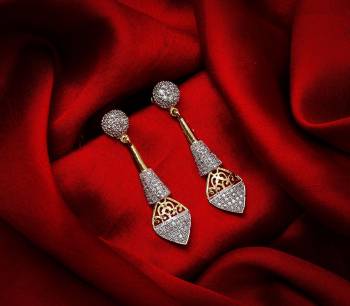 Here Is A Very Pretty Pair Of Simple And Elegant Looking Earring Set In Golden Color. It Has Pretty Unique pattern With Attractive Diamond Work. You can Pair This Even With Simple Attire As Well As A Heavy One. This Pretty Evergreen Design Compliments Any Kind Of Attire You Wear.