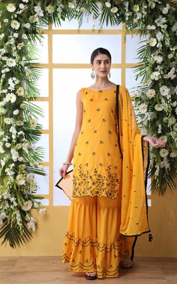 Celebrate This Festive Season With Beauty And Comfort Wearing This Designer Sharara Suit In All Over Musturd Yellow Color. Its Top And Bottom Are Cotton Based Paired With Chiffon Fabricated Dupatta. Its Top, Bottom And Dupatta are Beautified With Attractive Black Colored Embroidery. 