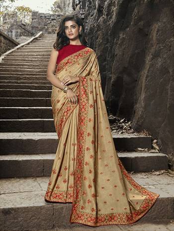 Here Is An Evergreen Color Pallete With This Heavy Designer Saree In Cream Color Paired With Red Colored Blouse. This Saree IS Fabricated On Satin Silk Paired With Jacquard Silk Fabricated Blouse. 