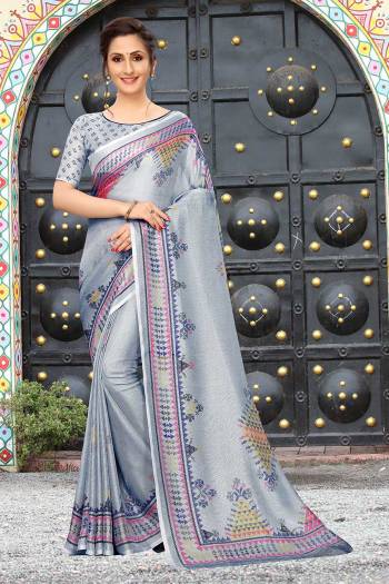 Add This Pretty Elegant Looking Saree To Your Wardrobe In Light Grey Color. This Saree And Blouse Are Linen Based Which Gives A Rich Look To Your Personality. Buy Now.
