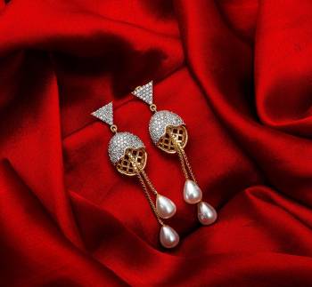 Here Is A Very Pretty Pair Of Simple And Elegant Looking Earring?Set In Golden Color. It Has Pretty Unique pattern With Attractive Diamond Work. You can Pair This Even With Simple Attire As Well As A Heavy One. This Pretty Evergreen Design Compliments Any Kind Of Attire You Wear.