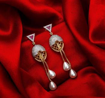 Here Is A Very Pretty Pair Of Simple And Elegant Looking Earring?Set In Golden Color. It Has Pretty Unique pattern With Attractive Diamond Work. You can Pair This Even With Simple Attire As Well As A Heavy One. This Pretty Evergreen Design Compliments Any Kind Of Attire You Wear.