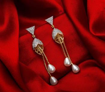 Here Is A Very Pretty Pair Of Simple And Elegant Looking Earring?Set In Golden Color. It Has Pretty Unique pattern With Attractive Diamond Work. You can Pair This Even With Simple Attire As Well As A Heavy One. This Pretty Evergreen Design Compliments Any Kind Of Attire You Wear.