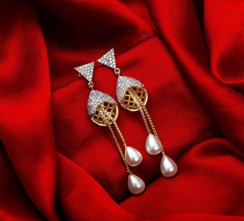 Here Is A Very Pretty Pair Of Simple And Elegant Looking Earring?Set In Golden Color. It Has Pretty Unique pattern With Attractive Diamond Work. You can Pair This Even With Simple Attire As Well As A Heavy One. This Pretty Evergreen Design Compliments Any Kind Of Attire You Wear.