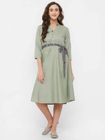 For A Trendy Look, Grab This Designer Readymade Kurti In Pastel Green Color. This Pretty Plain Kurti Is Fabricated On Rayon Which Comes With A Trendy Belt. This Pretty Kurti Will Definitely Earn You Lots Of Compliments From Onlookers.