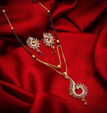 Grab This Designer Heavy Mangalsutra In Golden And Black Color Beautified With Diamond Work. This Mangalsutra Comes With A Set Of Pretty Matching Earrings. It Is Light In Weight And Easy To Carry Throughout The Gala. Buy Now.